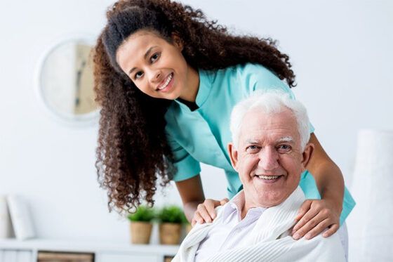 Caregivers for Seniors' Nurse Smiling with Elderly Man in Pittsburgh 