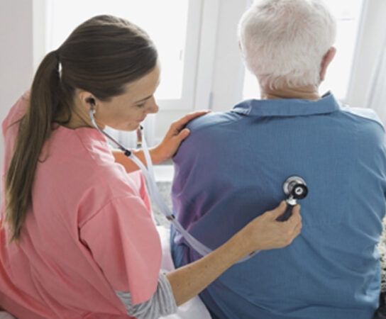 In-Home Senior Care by home health aide in Wexford, PA, using a stethoscope on an elderly man