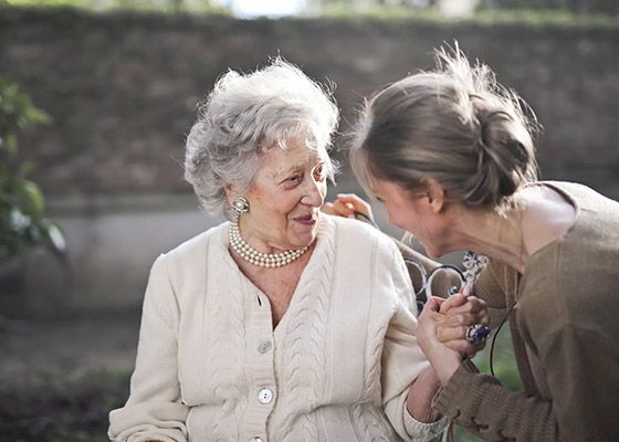 In home senior care in Tilton, NH, as home care assistant helps an elderly woman