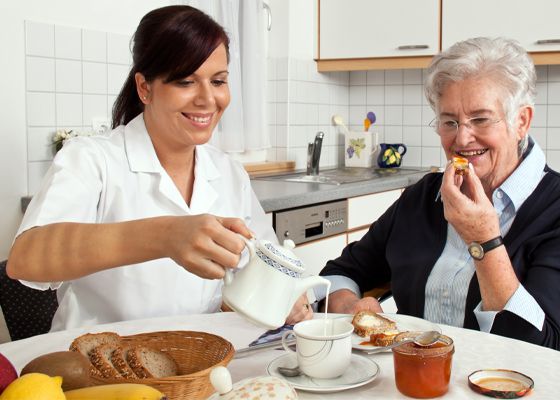 In Home Health Care Aide Feeding Breakfast to Elderly Woman in Pittsburgh, PA
